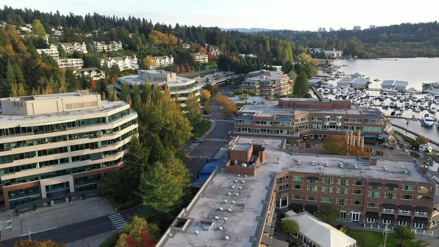 Cinematic drone trucking shot of The Woodmark Hotel, Yarrow Bay Marina, Carillon Point, Houghton Beach Park, Lakeview, in Central Houghton, Kirkland, by Lake Washington, affluent neighborhood