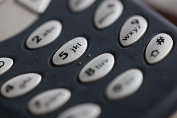 Closeup of buttons on mobile phone keyboard. Phone repair concept