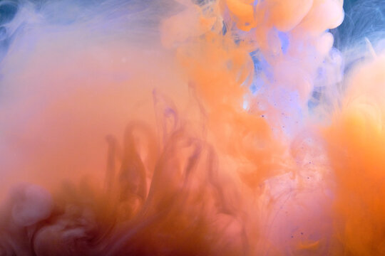 Blue-orange abstract background of flowing fluid.