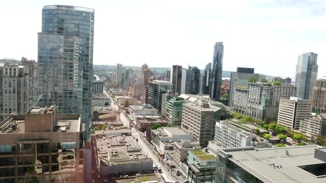 Medium angle aerial of downtown Vancouver, video taking from the business-building window.