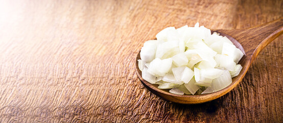 large Brazilian onions in rustic copper pot, shelled vegetables, seasoning or culinary ingredient