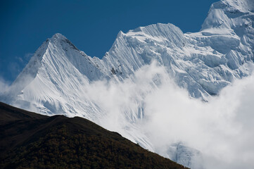 high Himalayan mountains peaks covered with snow and ice in daylight 