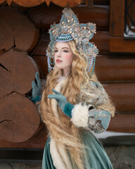 Girl in national Russian dress with a kokoshnik on her head