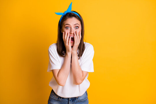 Photo of crazy amazed girl palms face excited look wear blue headband white t-shirt isolated yellow color background