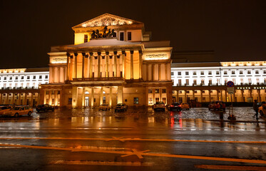 nightview of the city hall building with lights and dark sky in winter rain 