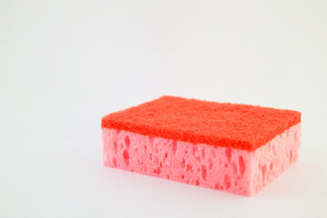 Table sponge red. Sponge for cleaning and washing dishes. Space for text.