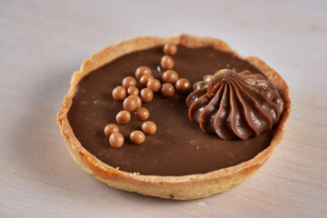 Chocolate tart on wooden board