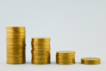 Metal coins are stacked in a column. Coins of Ukrainian hryvnia.