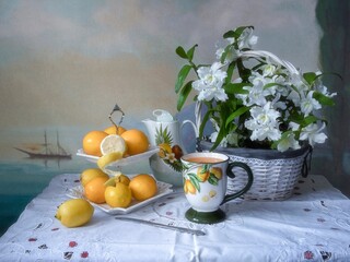 Still life with lemons and basket of orchid flowers