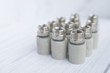 Combined couplings for connecting metal and polypropylene water pipes