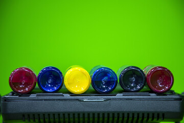 cyan, magenta, yellow and black Ink jet refill colors in bottles. Colors used in color printer