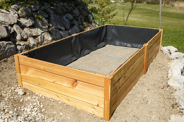 New wooden frame for a raised garden bed. - 414442652