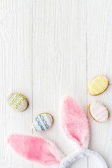 Happy Easter background. Bunny ears with eggs cookies, space for text