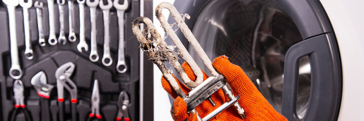 Treatment of Calcium Deposits in Water Heater. Limescale on the heating element for washing...