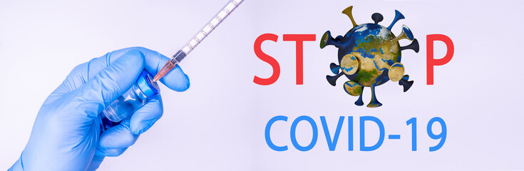 Syringe in a hand of a doctor or nurse and medicine or vaccine vial. Vaccination and immunization concept. Medicine and health care. Vaccine trials and research. Pharmacy. COpy space
