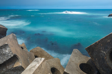 A view at the ocean with motion blur from the harbor wall, Lambert's Bay, West Coast, South Africa.
