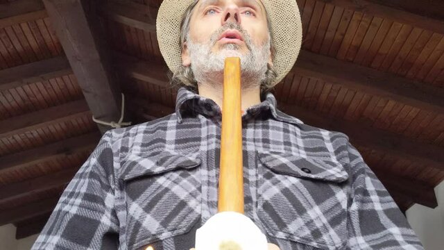 man with traditional native american indian pipe