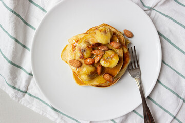 Pancakes with honey and banana on a plate. Banana pancake. Healthy food. Ketogenic diet.