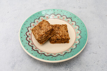 Sweet made from peanuts and sugar on a plate. Traditional sweet in southern Brazil. Rapadura de amendoim
