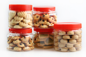 Chinese New Year traditional butter cookies in plastic containers isolated on white background.