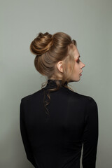 Young woman profile and back on gray background, portrait