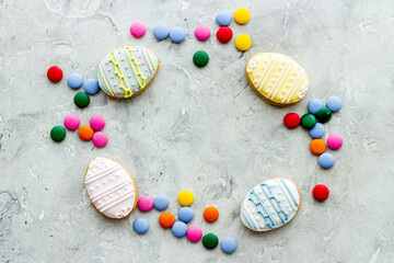 Happy Easter frame of cookies eggs and sweets, top view