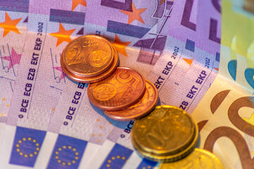 coins on the euro banknotes