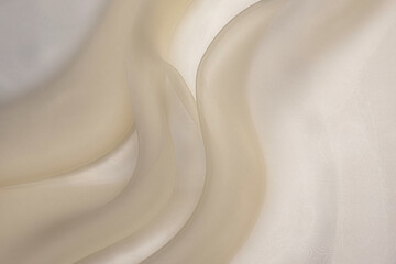 Silk fabric or organza is light beige color. Tissue background concept - obrazy, fototapety, plakaty