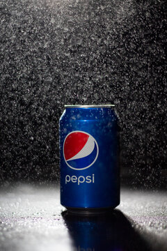 Pepsi soda can with water drops splashes on black background editorial stock photo. Pepsico brand company. Carbonated sweet soft drink. Pepsi logo