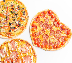 three different kinds of pizzas
