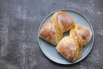 two fresh buns with cheese covered with frosting, dessert, yeast dough
