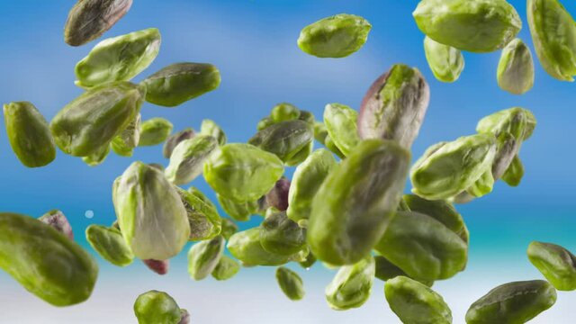 Flying of Peeled Pistachios in Sky Background