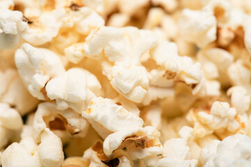 close up view of delicious airy popcorn, cinema concept