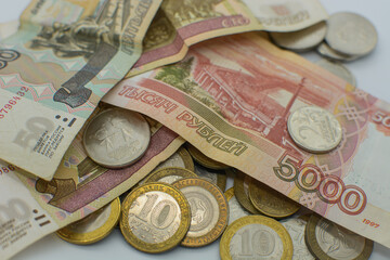 Russian rubles in paper and metal form .