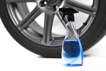 Blue spray for cleaning the wheels. Close up. Isolated on a white background