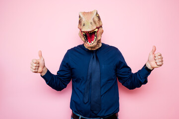 Man with euphoric dinosaur head and fingers up