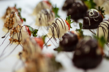 Closeup of chocolate strawberries homemade recipe, piped decoration
