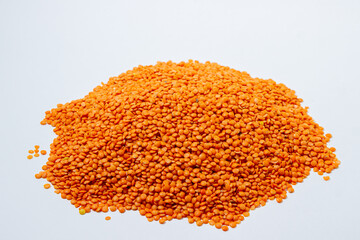 Red lentils on a white background. Lentil variety. Nutritious protein food
