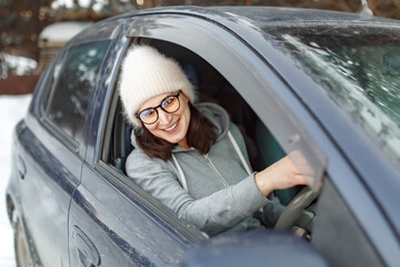 Beautiful Young Woman Driver Behind The Wheel blue Car