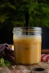 Homemade salted caramel in jam jar, butter cream sauce