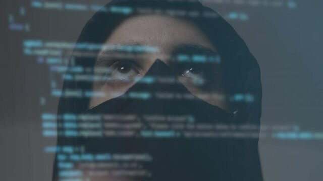 Cyber hacker or spyware with binary code on the screen