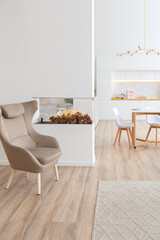 interior design spacious bright studio apartment in Scandinavian style and warm pastel white and beige colors. trendy furniture in the living area and modern details in the kitchen area.