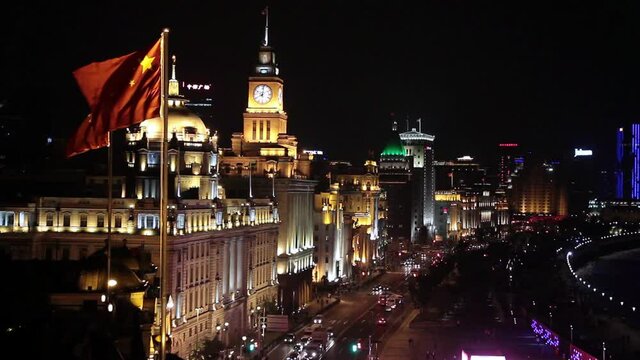 The Bund or Waitan in Shanghai, China. The Bund is a riverfront area in central Shanghai with many historic concession era buildings. The illuminations on the Bund at night are popular with tourists i