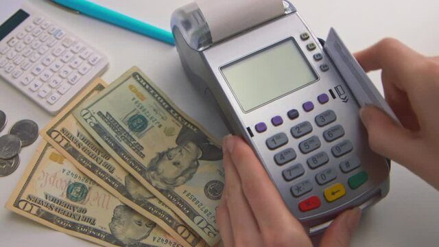 A woman's hand swipes a card into a debit machine. The screen says "DECLINED". Check out this seller's other videos for "APPROVED" transactions. (Camera Used: Canon C300)