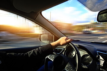 driving fast a car down the street