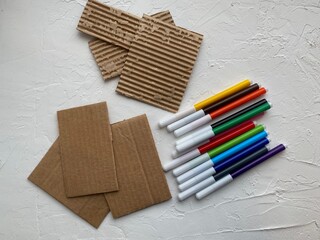 Cardboard and corrugated cardboard, for children's craft, and markers