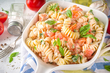 Spring diet healthy vegan pasta. Italian fusilli pasta with tomatoes, green vegetables, fresh...