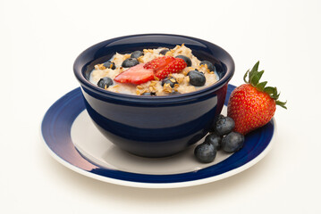 oatmeal with fresh fruit and flax in a blue bowl