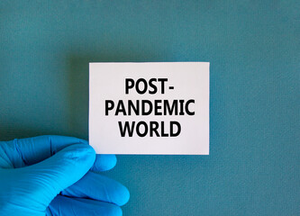 Post-pandemic world symbol. Hand in blue glove with white card. Concept words 'Post-pandemic...