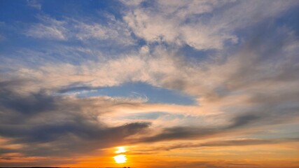 Beautiful sky with clouds at sunset Part of the image is blurred.